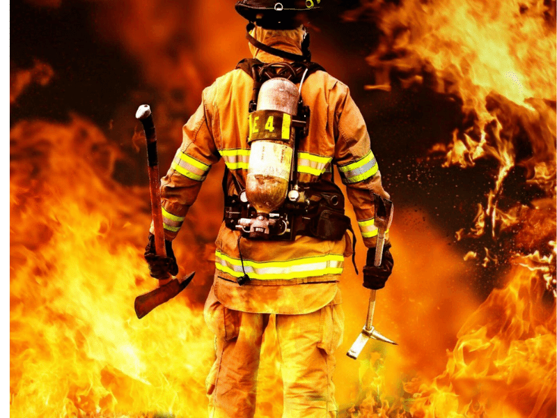 Fireman looking into fire. 