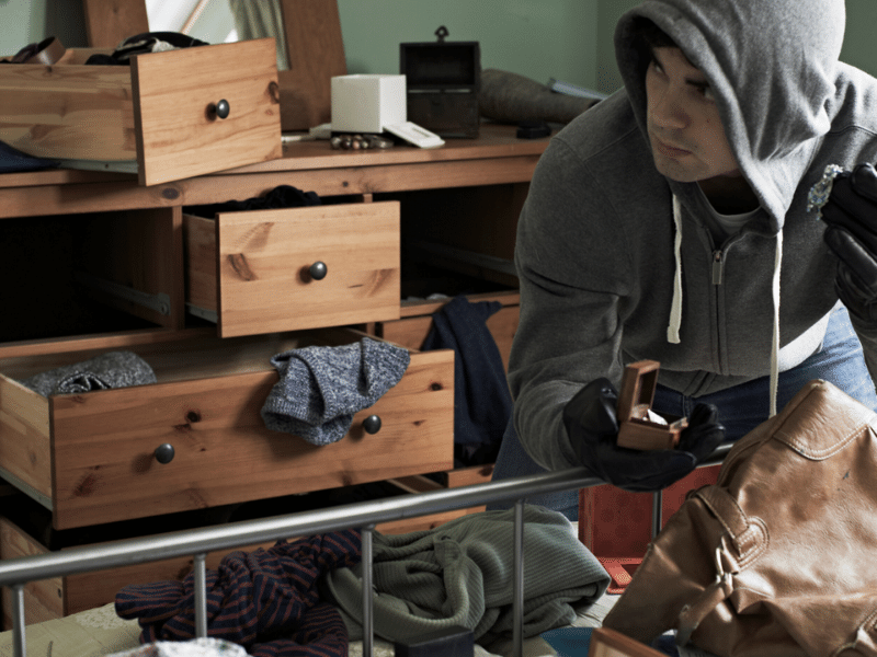 Burglar tossing room and dresser. 